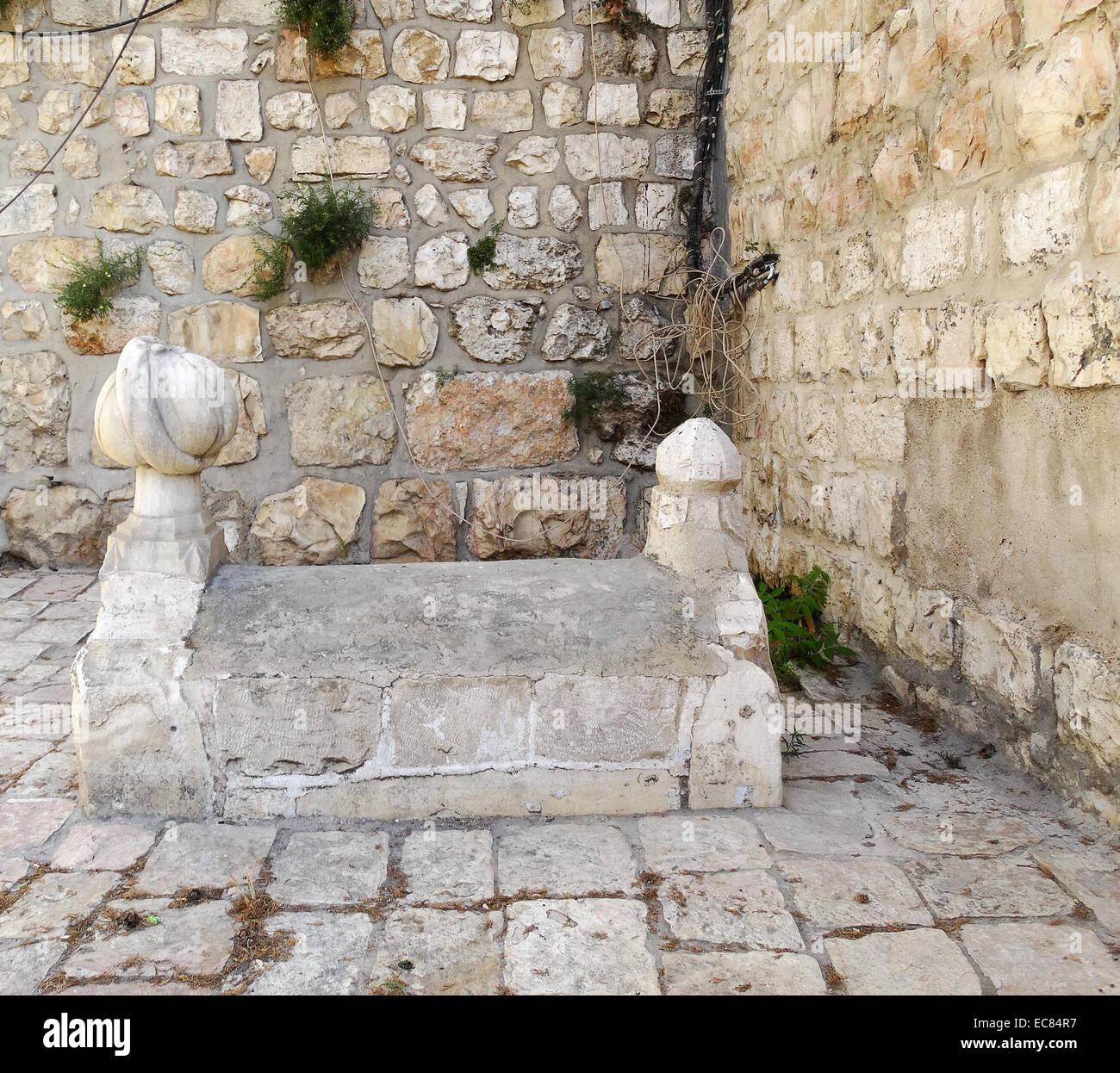Arab grave stone and tomb at the Jaffa Gate; a stone portal in the historic walls of the old City of Jerusalem. It is one of eight gates in Jerusalem's Old City Walls. Stock Photo