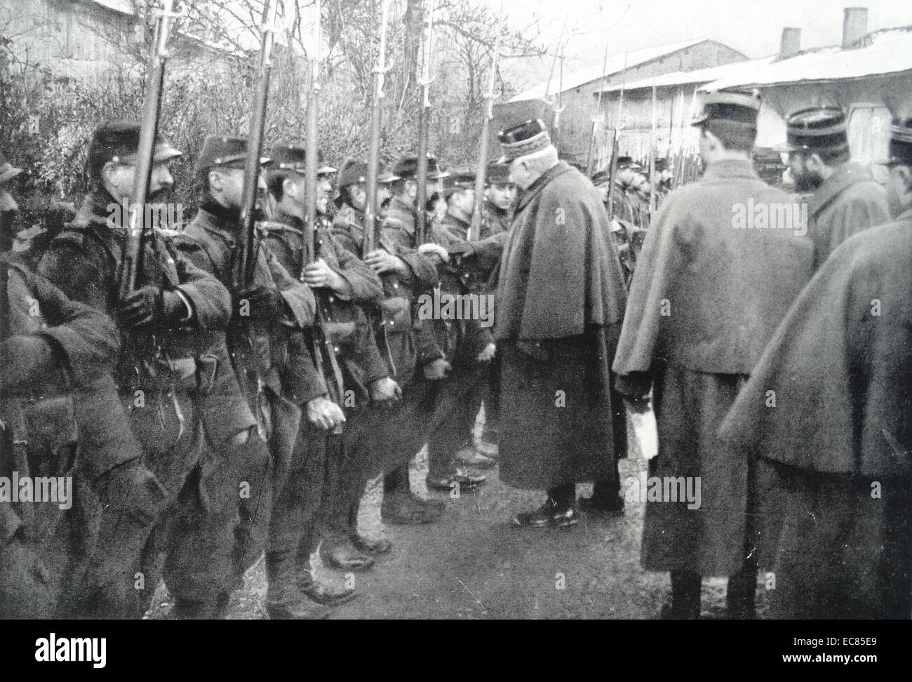 Photograph of Marshal Joseph Joffre (1852-1931) French general during World War I is seen here reviewing soldiers. Dated 1915 Stock Photo