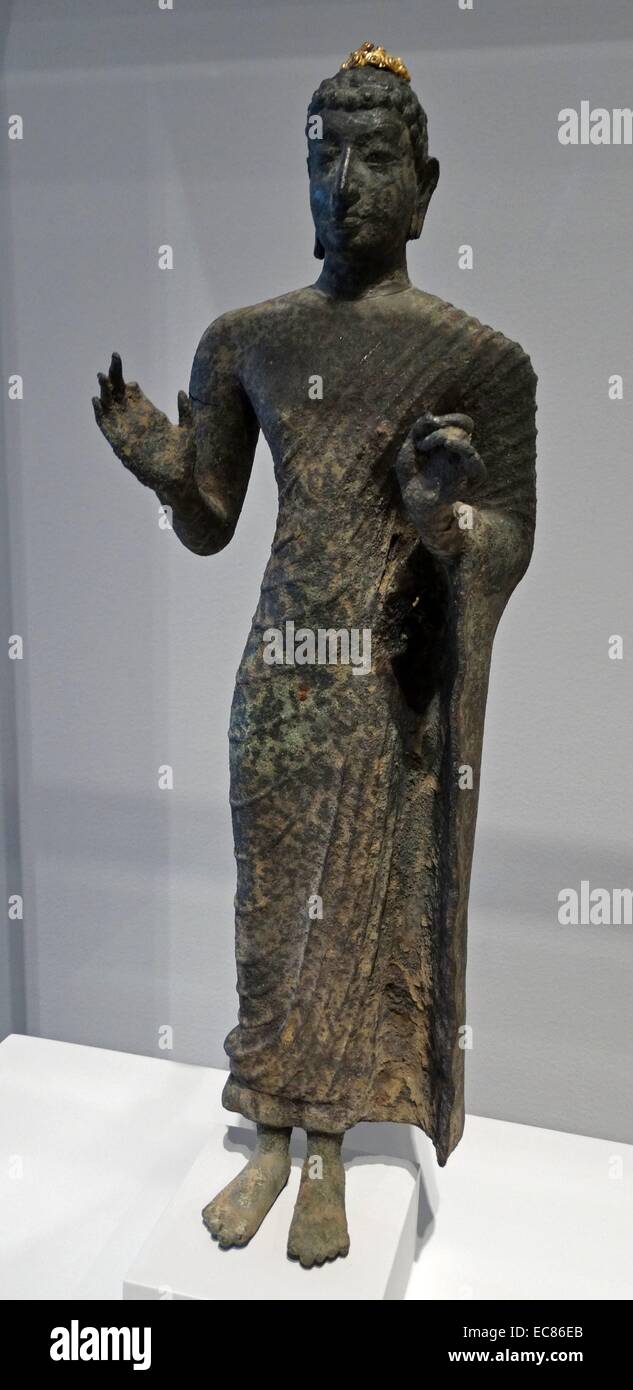 Bronze Standing Buddha from Indonesia. Dated 8th Century Stock Photo
