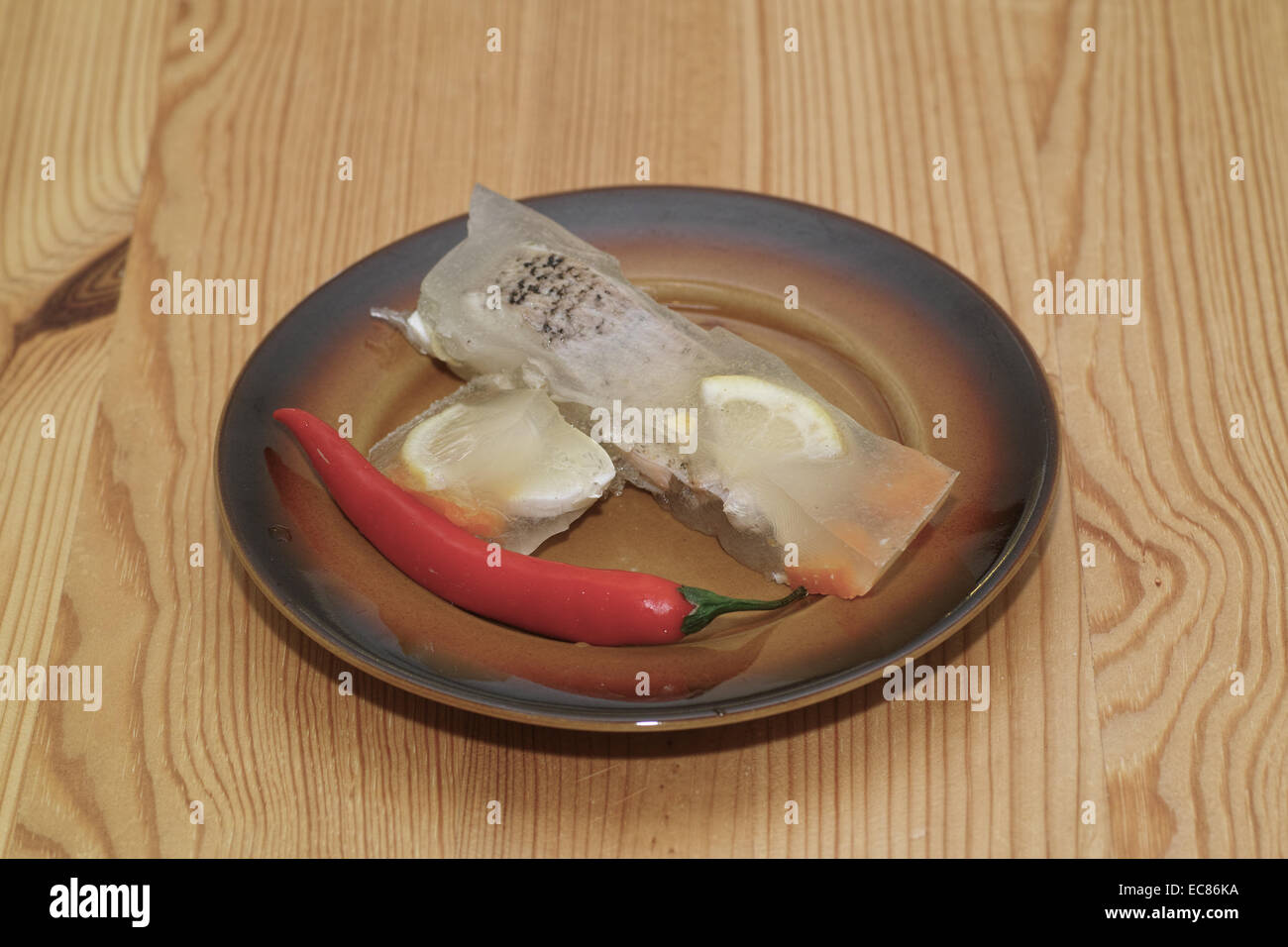 Fish pike. In the Polish kitchen, on the Polish table. Preparing pike in jelly, Polish cuisine specialty. Stock Photo
