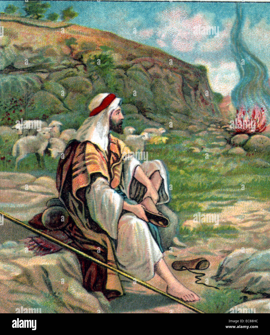Moses hears God in the burning bush. Scene from the Old Testament Bible. Dated 1910 Stock Photo