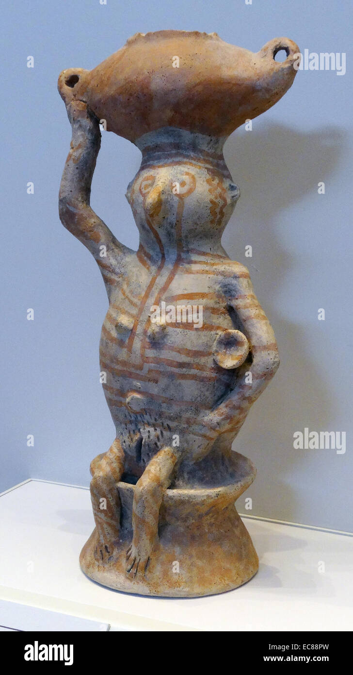 Vessel in the shape of a woman carrying a churn. From Gilgat, Negev, over 6,500-5,500 years ago, made from pottery. Stock Photo
