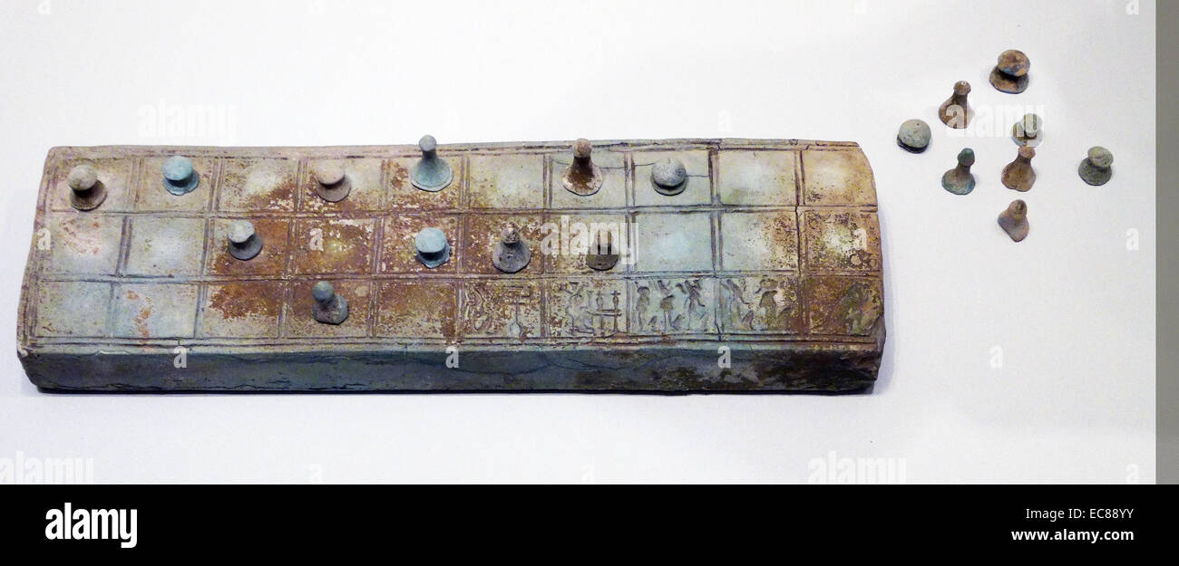 Game of senet, including the game board and twenty playing pieces. From the 15th-13th century BC. Stock Photo