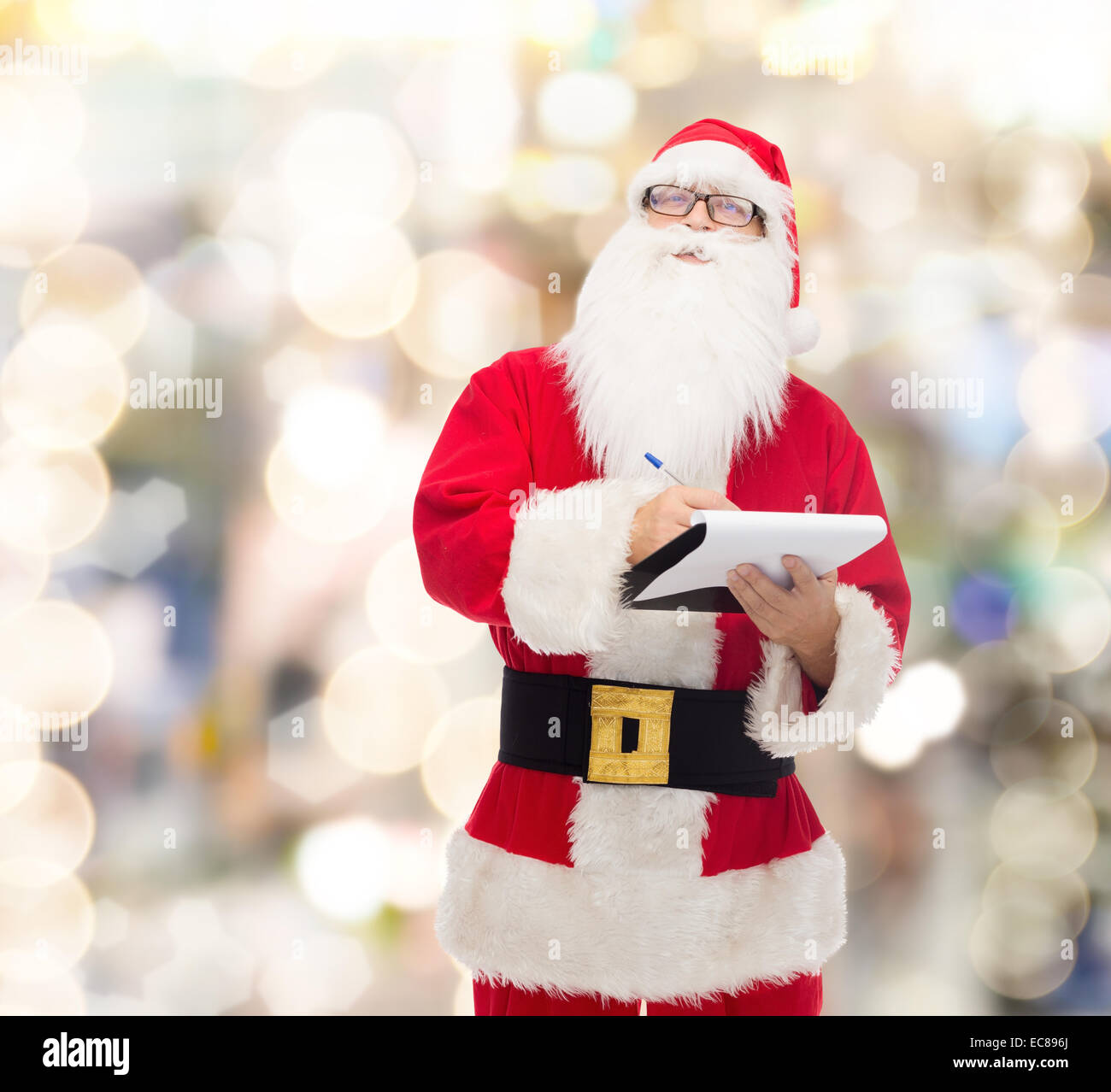 man in costume of santa claus with notepad Stock Photo - Alamy