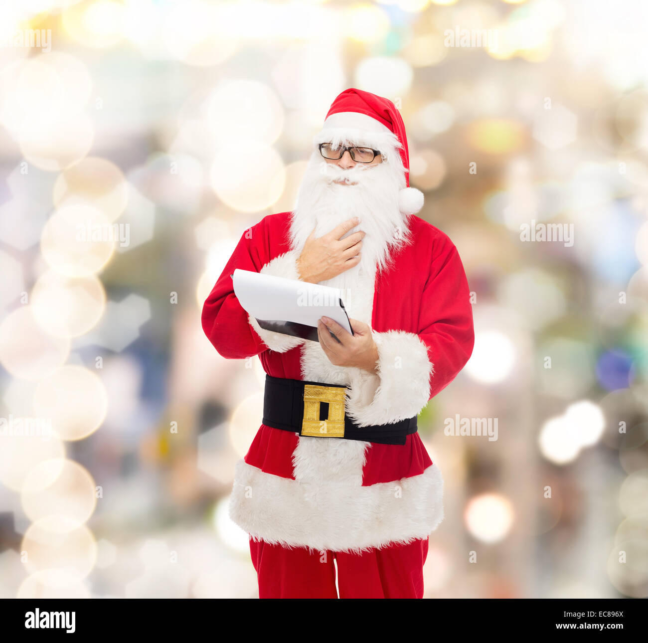 man in costume of santa claus with notepad Stock Photo - Alamy