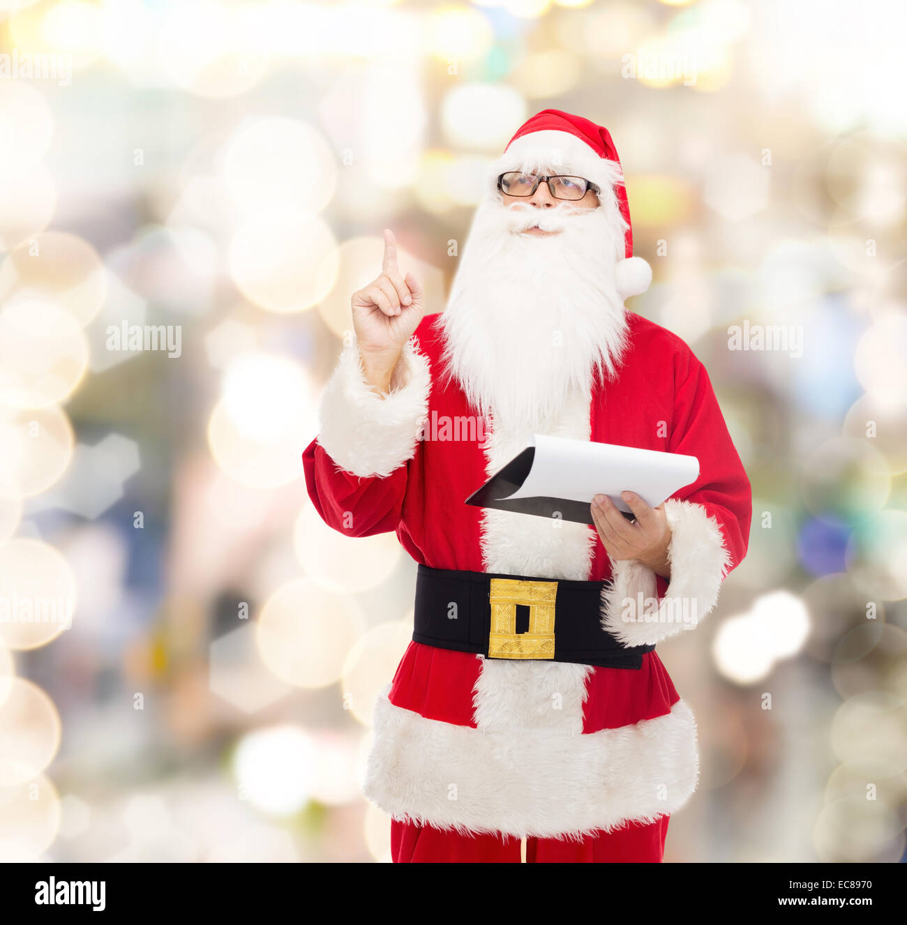 man in costume of santa claus with notepad Stock Photo - Alamy