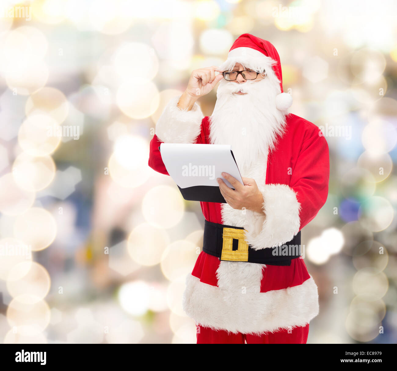 man in costume of santa claus with notepad Stock Photo - Alamy
