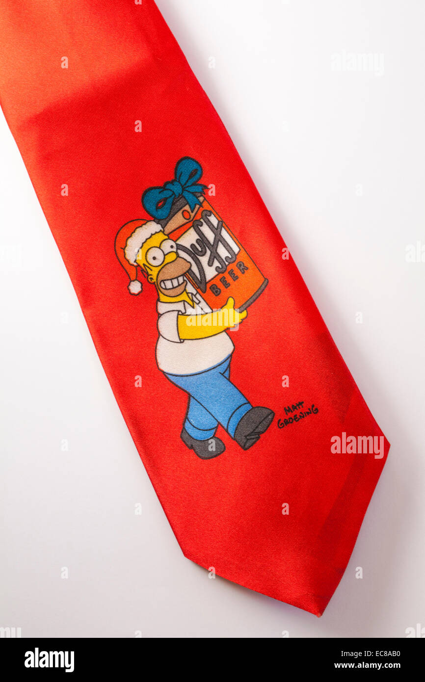 Novelty Christmas tie with Homer Simpson carrying Duff beer set on white background Stock Photo