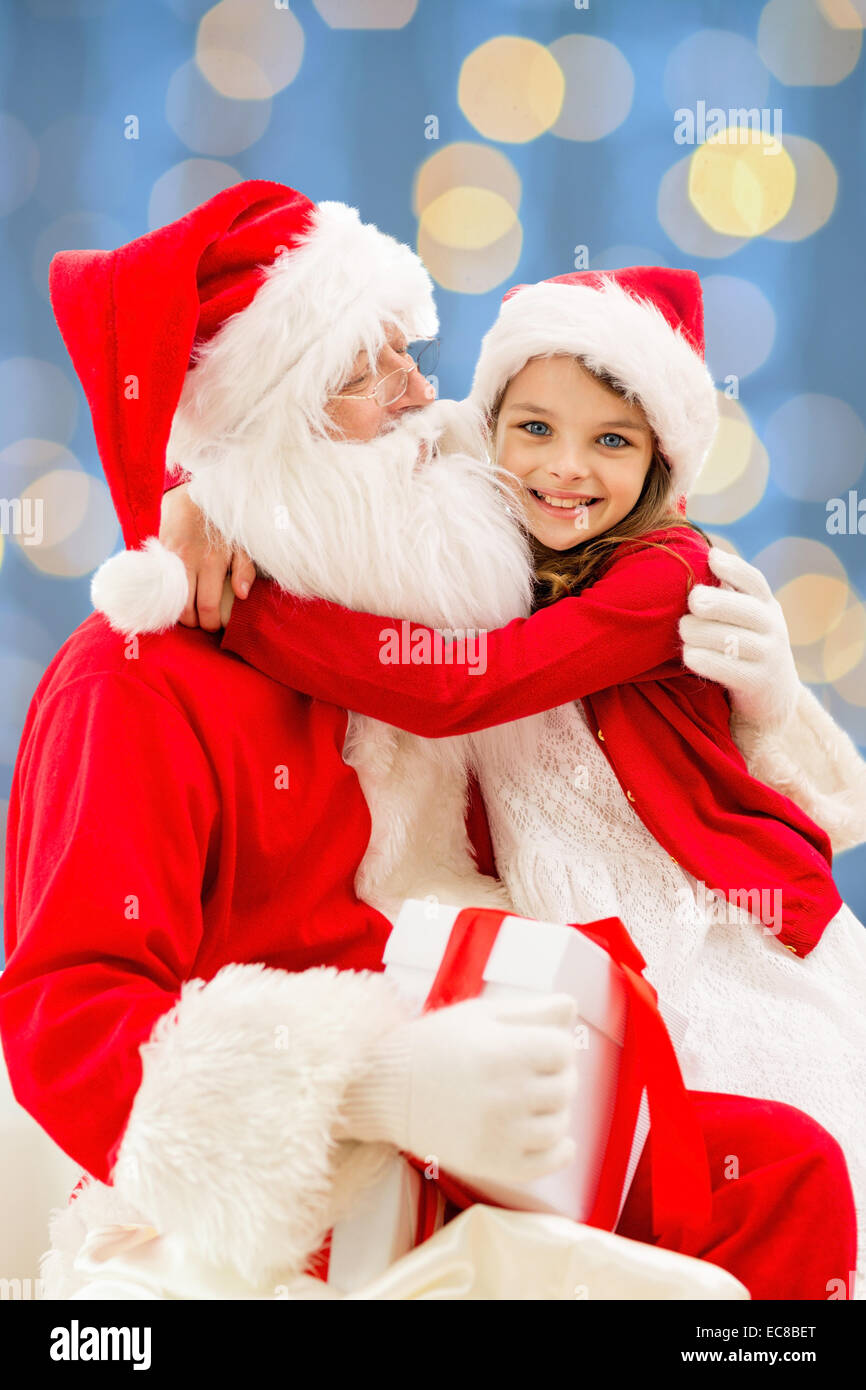 smiling little girl with santa claus Stock Photo - Alamy