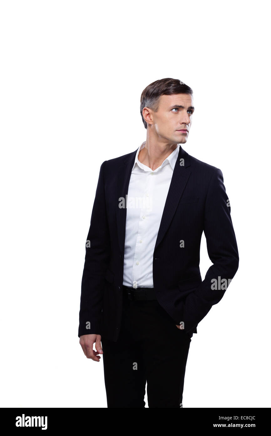 Young confident businessman looking away over white background Stock ...