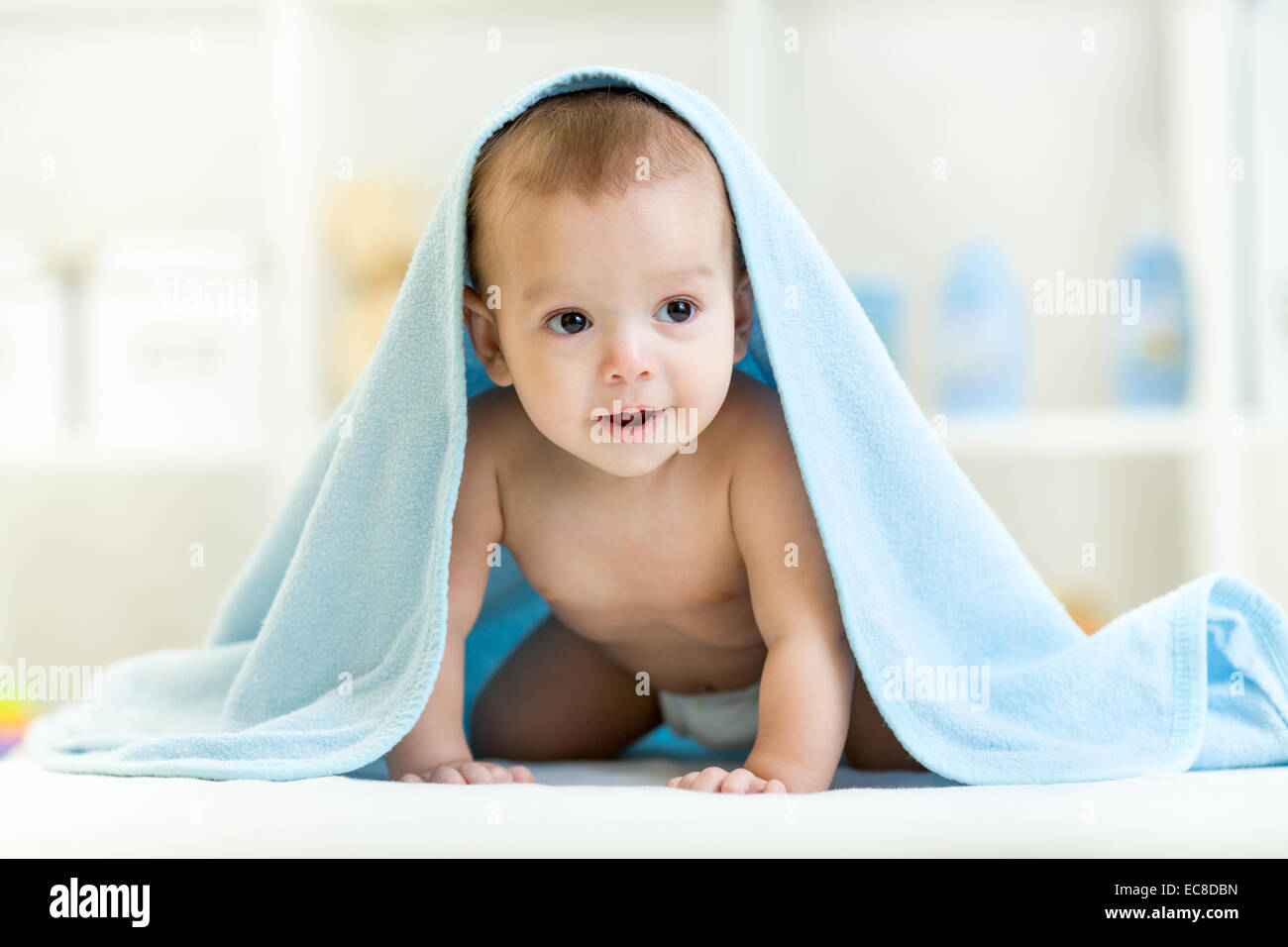 Adorable happy baby boy in towel indoor Stock Photo Alamy