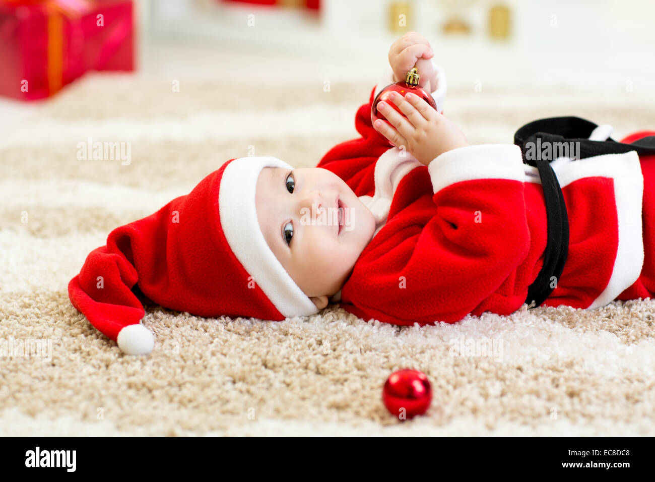 Cute Baby boy weared Christmas clothes at home Stock Photo