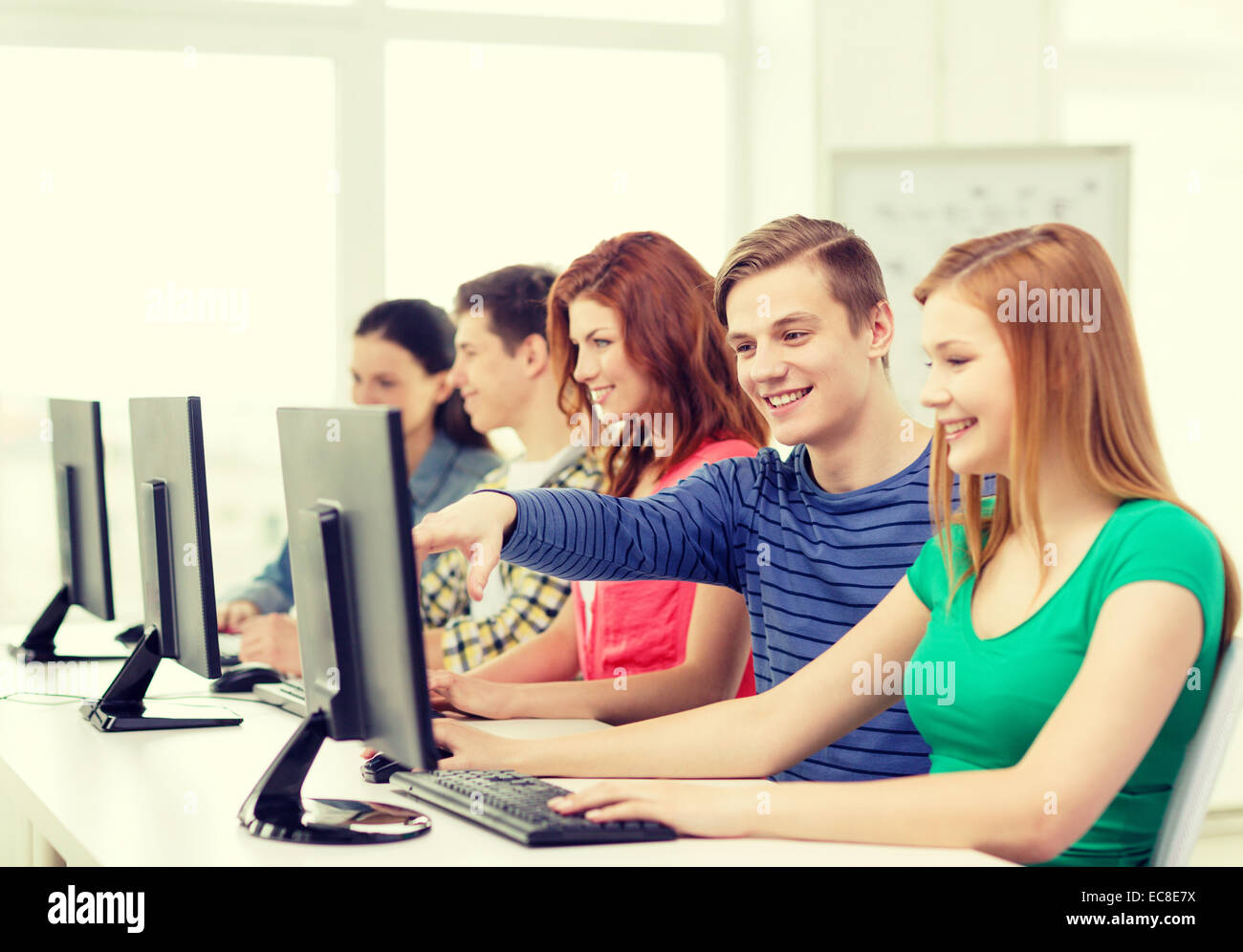 female student with classmates in computer class Stock Photo - Alamy