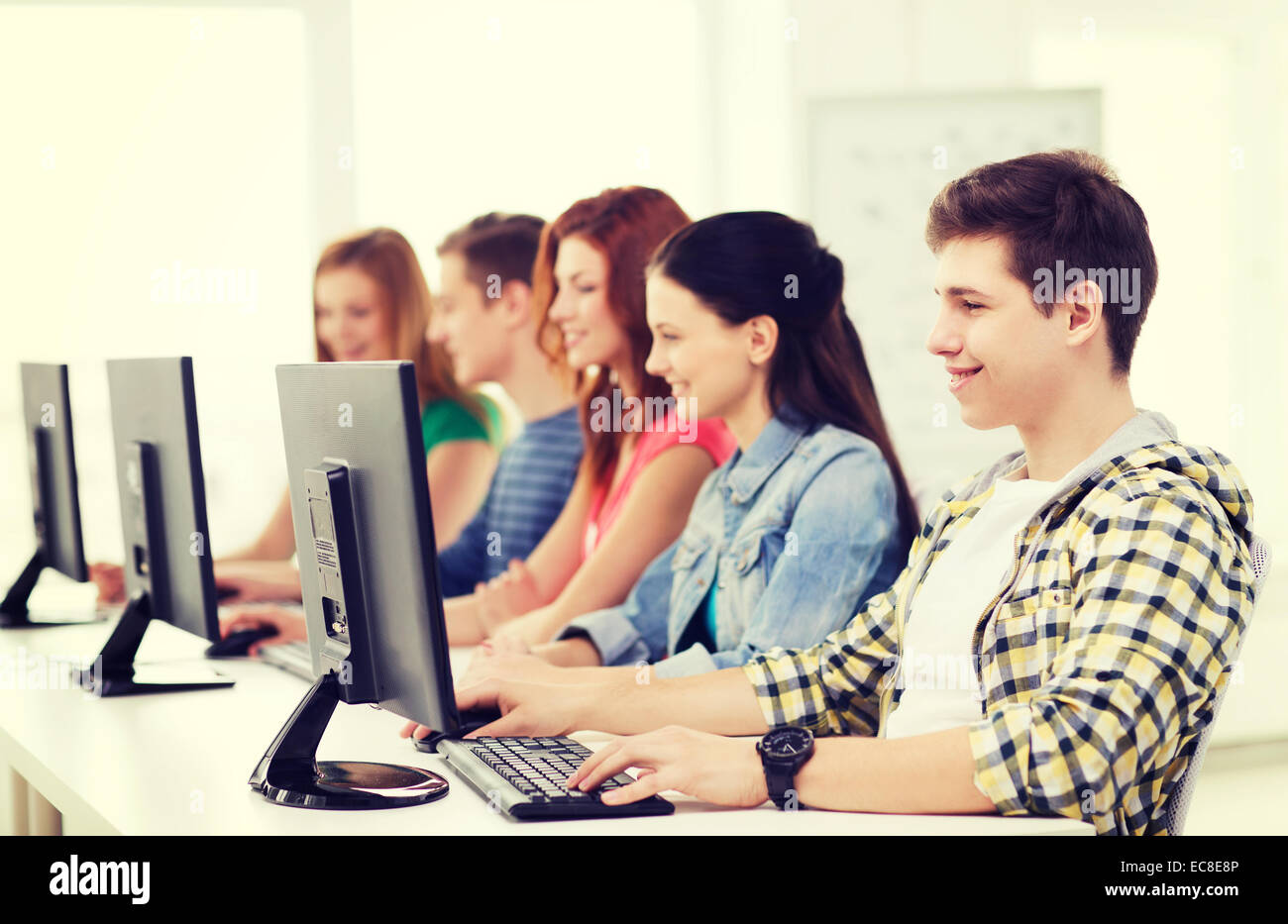 male student with classmates in computer class Stock Photo - Alamy