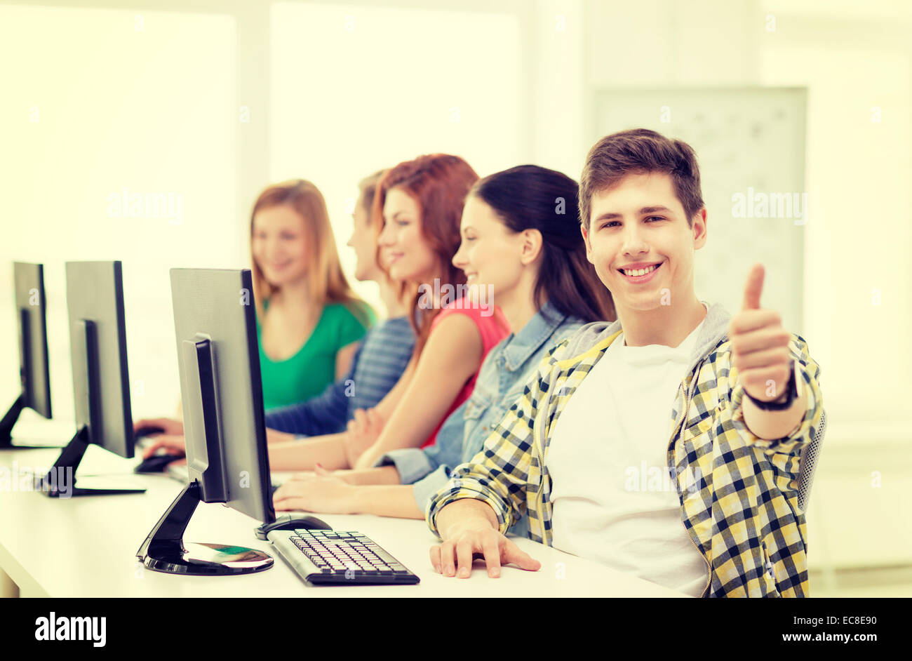male student with classmates in computer class Stock Photo - Alamy