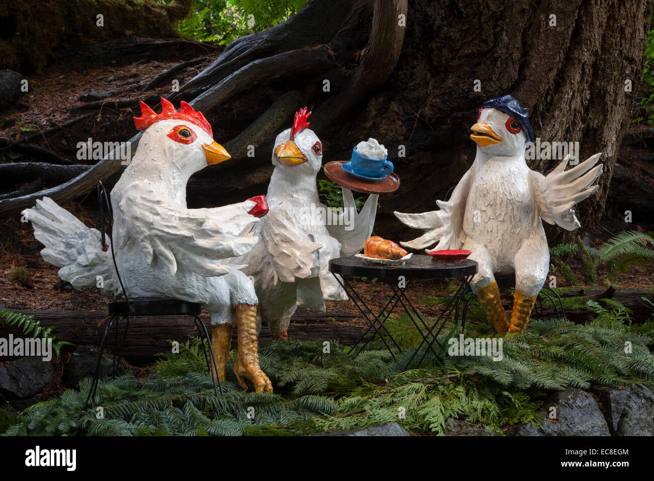 Three chicken replicas having tea party in Butchart GardensVictoria