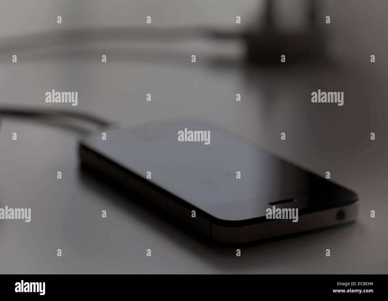 Closeup of slimline external hard drive with power plug Stock Photo