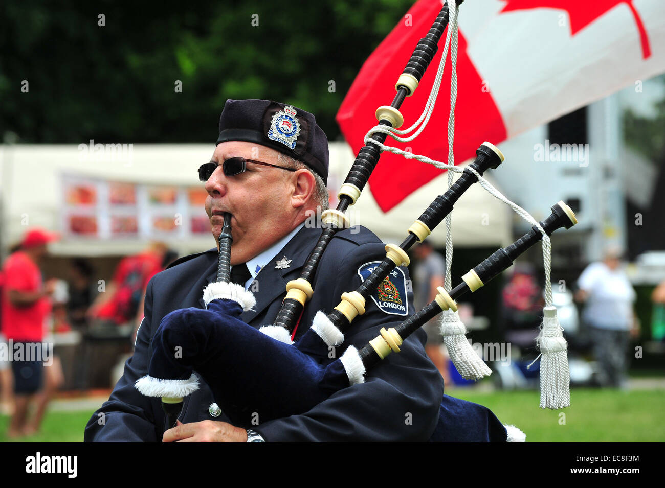 An Ontario police bagpiper plays the bagpipes during Canada Day  celebrations Stock Photo - Alamy