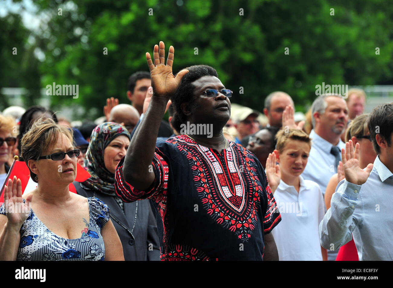 'People swear allegiance to Canada during a Canadian citizenship ceremony held on Canada Day. Stock Photo