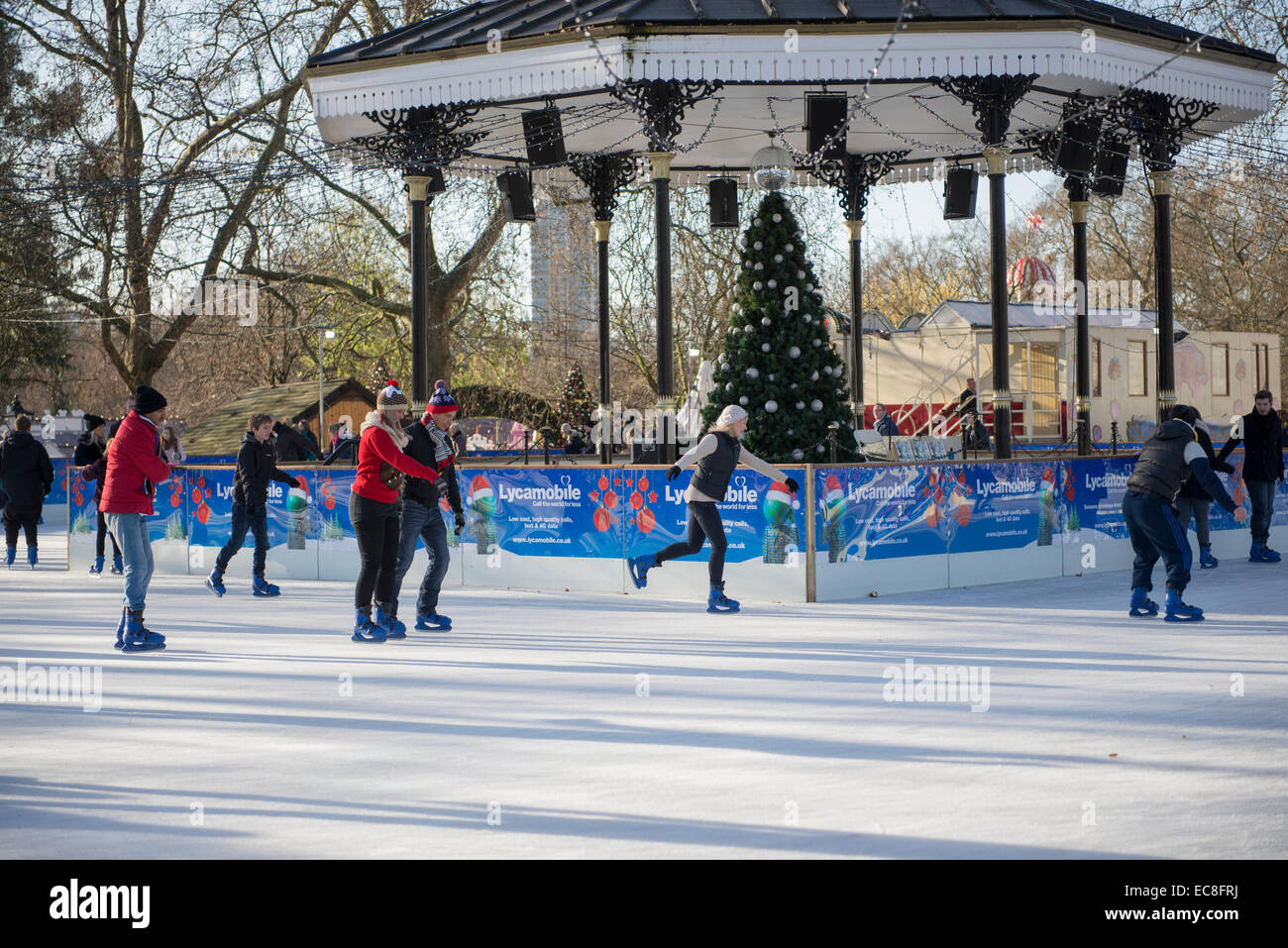 Couple ice skating at the Winter Wonderland in Hyde Park, London