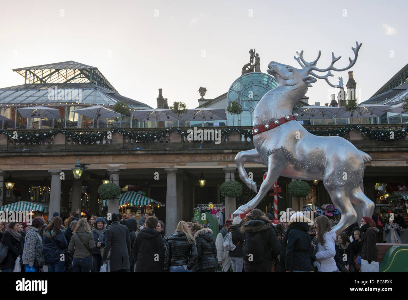 Tourists enjoying the Christmas decorations at Covent Garden, London, England. December 2014 Stock Photo
