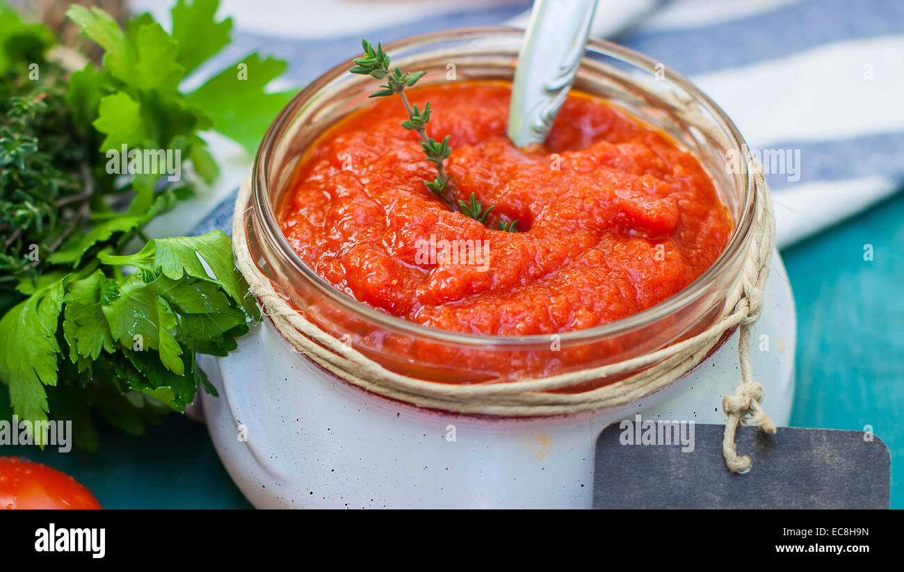 tomato sauce on glass bottle with label Stock Photo - Alamy