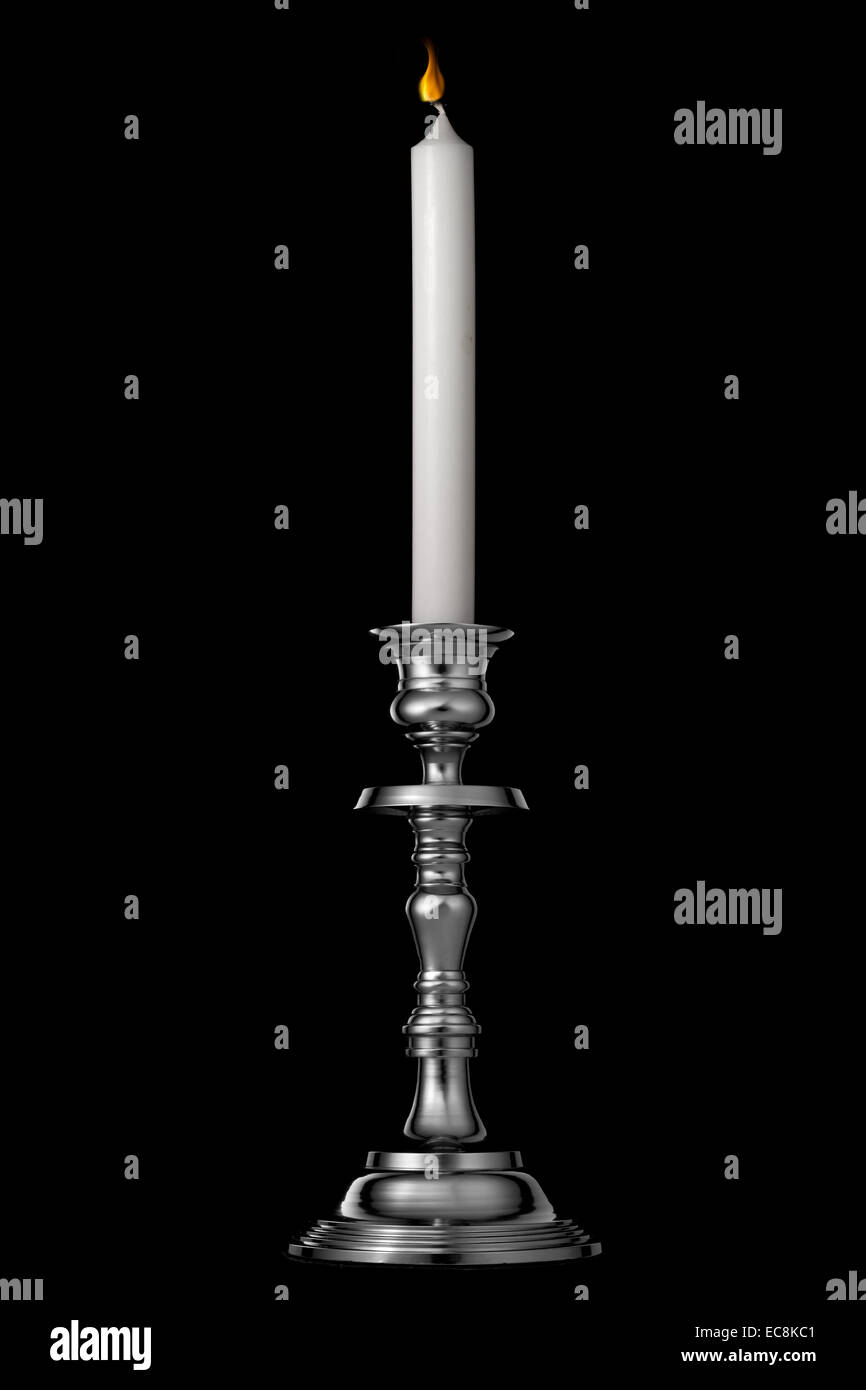 Silver candlestick with candle isolated on black Stock Photo Alamy