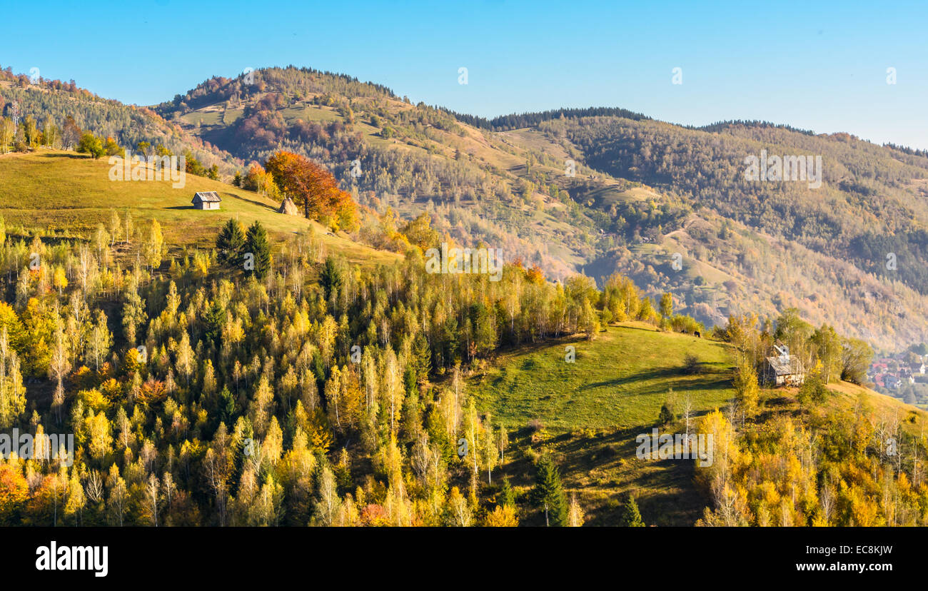 Countryside landscape in a romanian villlage at the food of Piatra Craiului Mountains Stock Photo