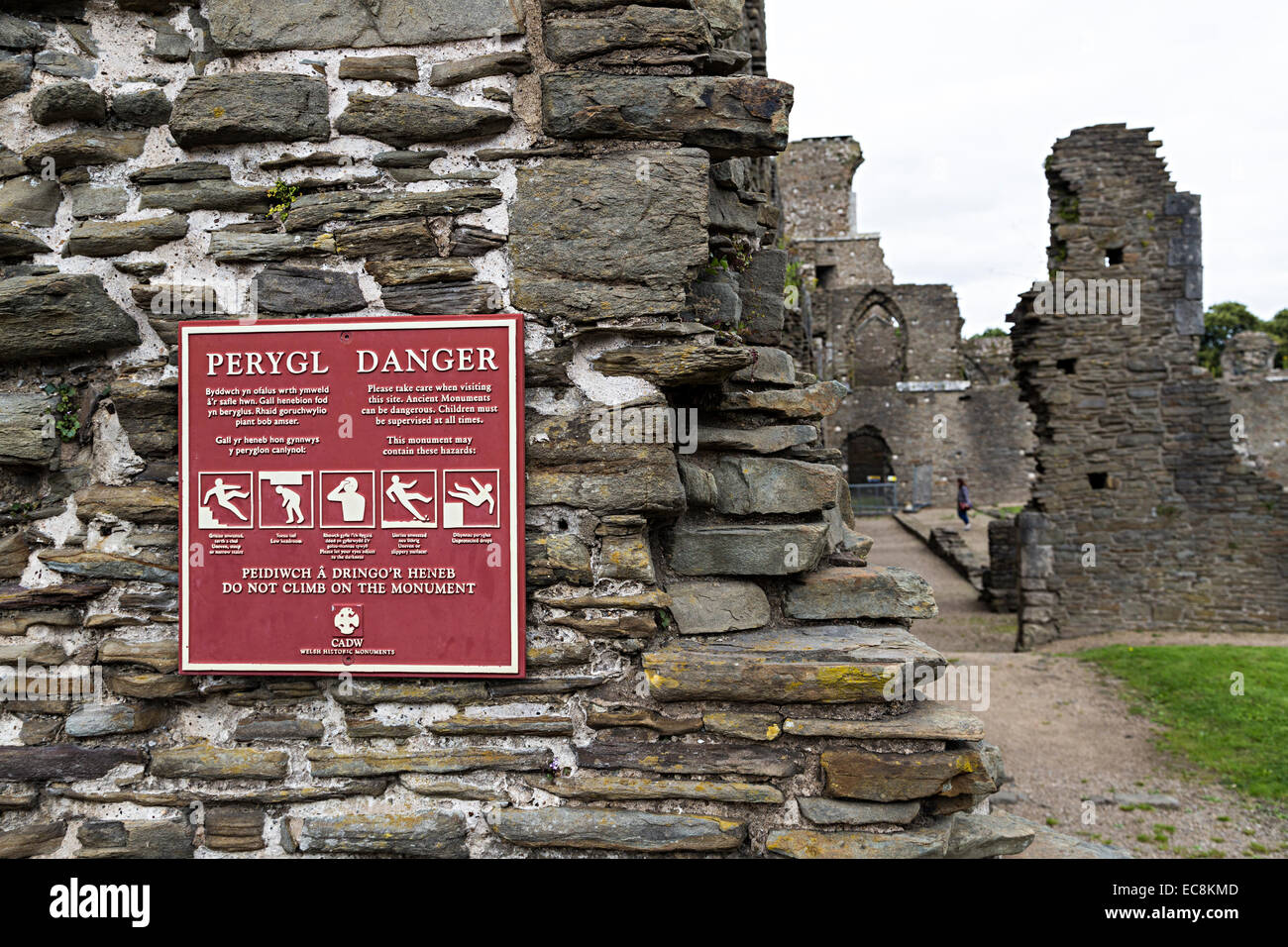 Danger do not climb on ruin sign in English and Welsh, Neath Abbey ruins, Neath, Glamorgan, Wales, UK Stock Photo