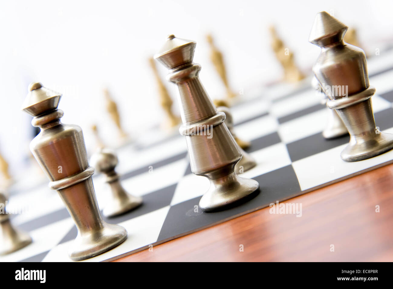 Classic chess game - view of playing pieces on chessboard with sunlight ...
