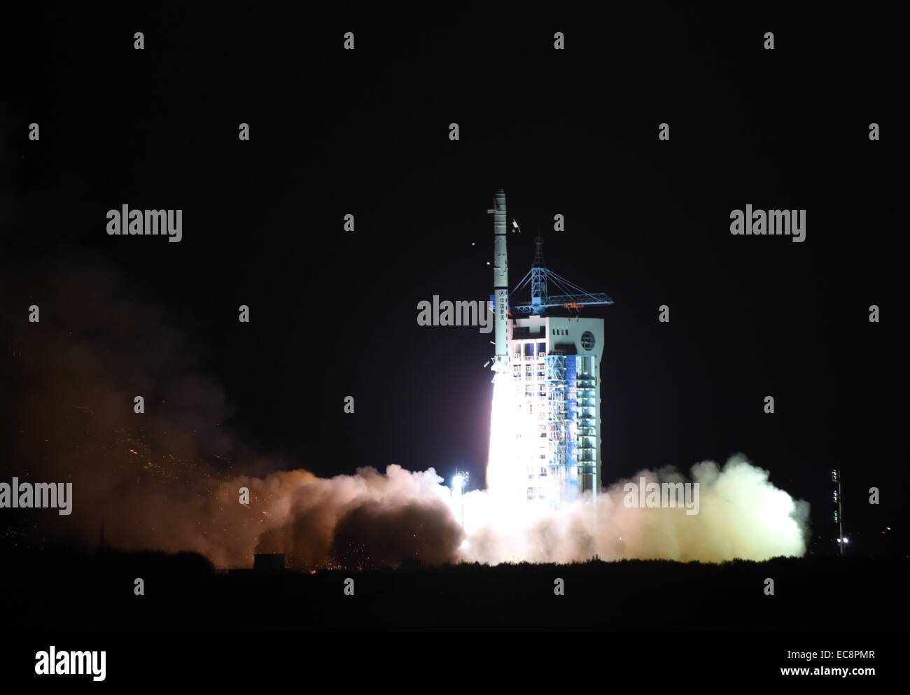 Jiuquan, China's Gansu Province. 11th Dec, 2014. A Chinese Long March-4C rocket carrying the Yaogan-25 remote sensing satellite blasts off from the launch pad at the Jiuquan Satellite Launch Center in Jiuquan, northwest China's Gansu Province, Dec. 11, 2014. It was the 201st mission for the Long March rocket technology. Yaogan satellites are mainly used for scientific experiments, natural resource surveys, crop yield estimates and disaster relief. Credit:  Yan Yan/Xinhua/Alamy Live News Stock Photo