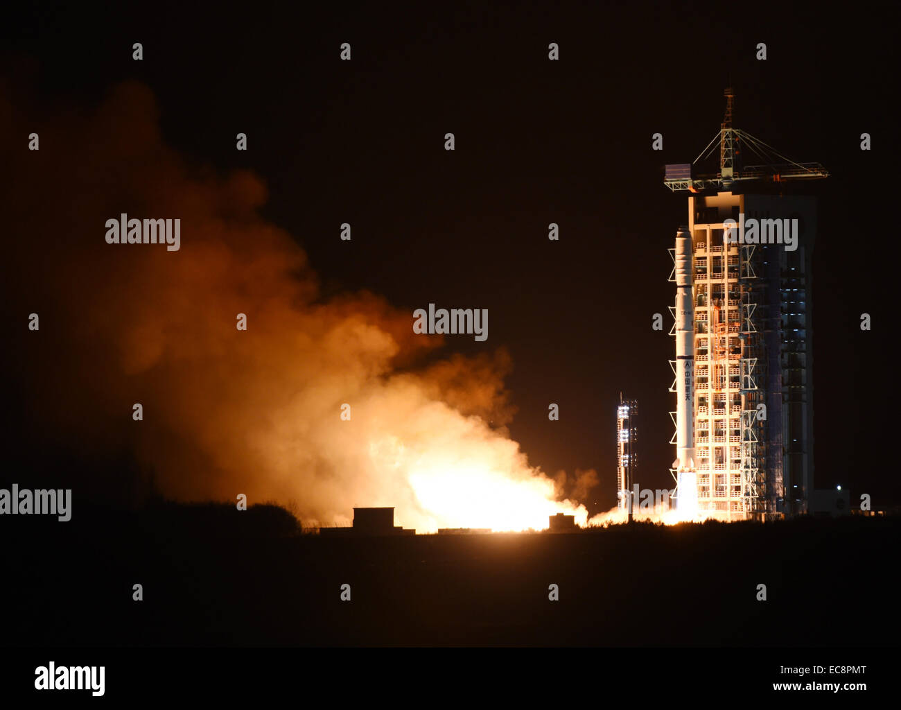 Jiuquan, China's Gansu Province. 11th Dec, 2014. A Chinese Long March-4C rocket carrying the Yaogan-25 remote sensing satellite blasts off from the launch pad at the Jiuquan Satellite Launch Center in Jiuquan, northwest China's Gansu Province, Dec. 11, 2014. It was the 201st mission for the Long March rocket technology. Yaogan satellites are mainly used for scientific experiments, natural resource surveys, crop yield estimates and disaster relief. Credit:  Yan Yan/Xinhua/Alamy Live News Stock Photo