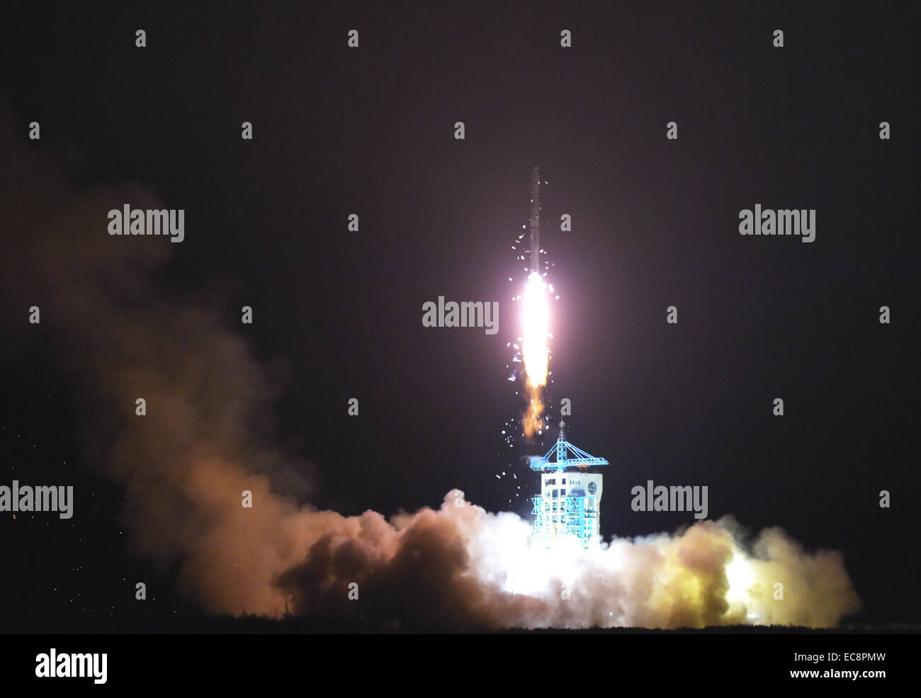 Jiuquan, China's Gansu Province. 11th Dec, 2014. A Chinese Long March-4C rocket carrying the Yaogan-25 remote sensing satellite blasts off from the launch pad at the Jiuquan Satellite Launch Center in Jiuquan, northwest China's Gansu Province, Dec. 11, 2014. It was the 201st mission for the Long March rocket technology. Yaogan satellites are mainly used for scientific experiments, natural resource surveys, crop yield estimates and disaster relief. Credit:  Yan Yan/Xinhua/Alamy Live News Stock Photo
