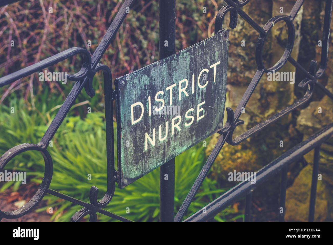 District Nurse Sign On A Garden Gate Stock Photo