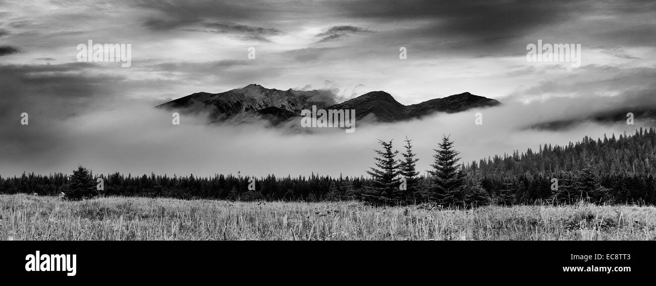Morning clouds reveal mountain tops, Lake Clark National Park, Alaska Stock Photo