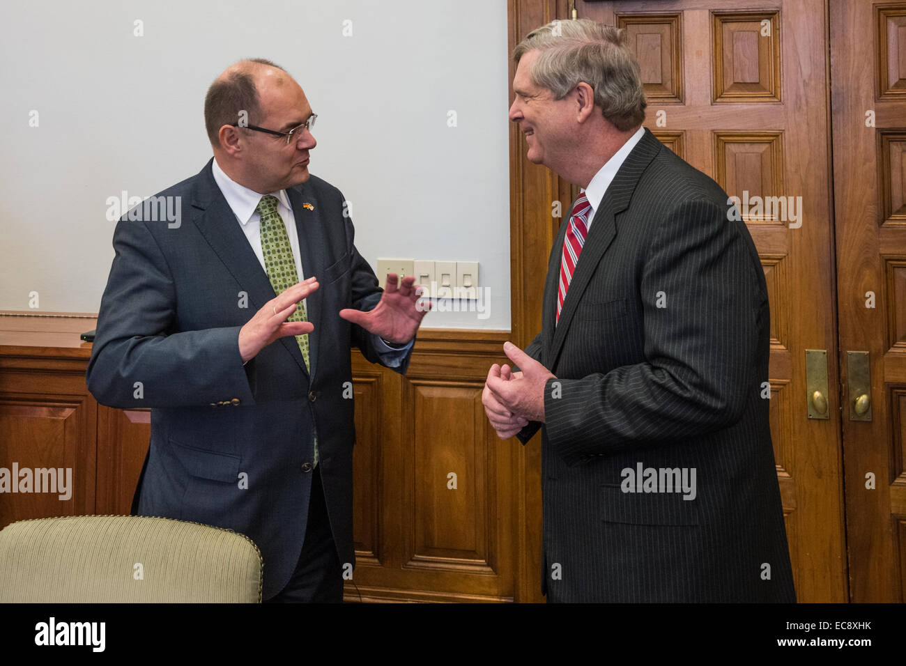 US Agriculture Secretary Tom Vilsack talks with Christian Schmidt, Agriculture Minister of Germany following their meeting at the United States Department of Agriculture December 10, 2014 in Washington, DC. Stock Photo