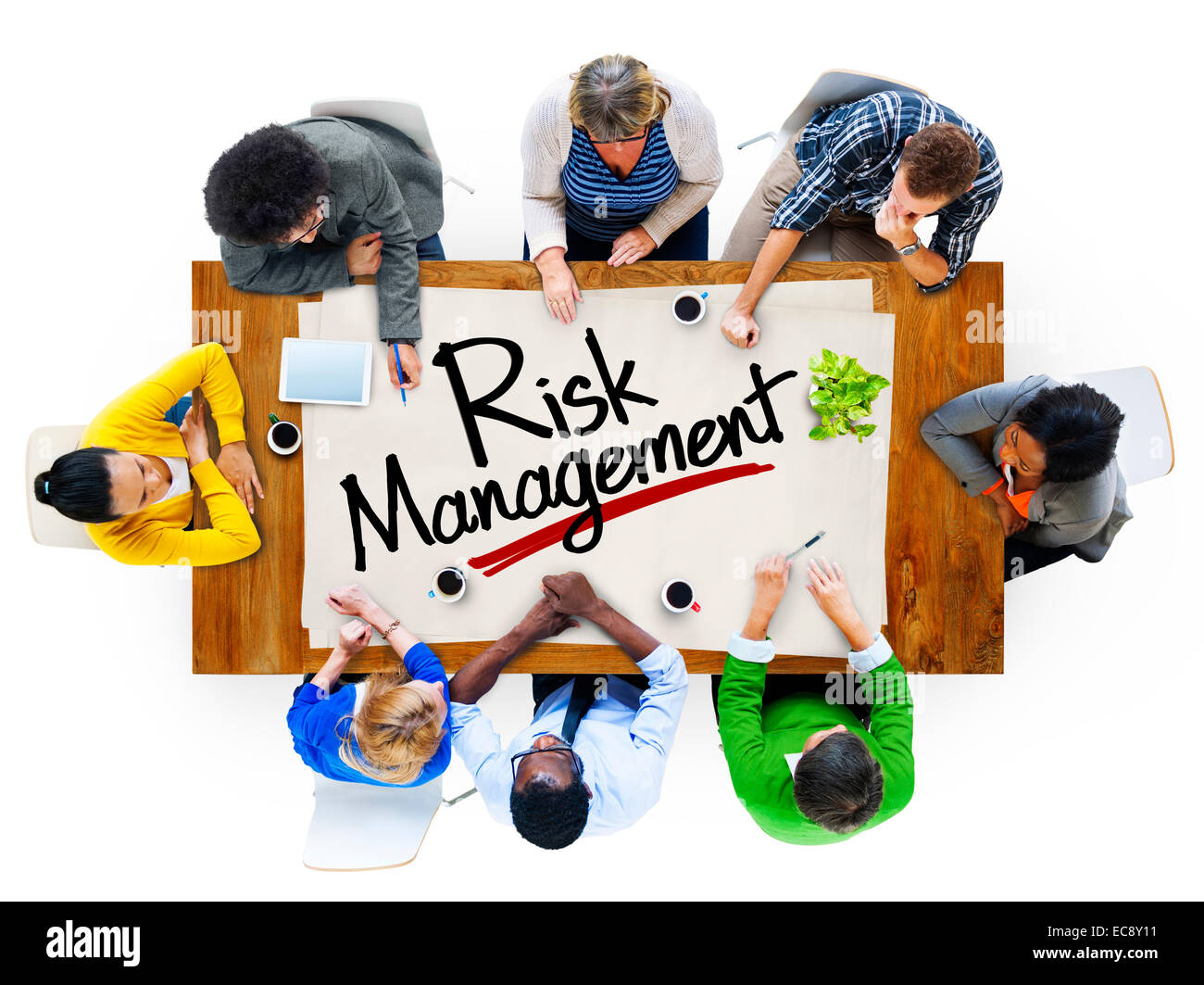 People in a Meeting and Risk Management Concepts Stock Photo