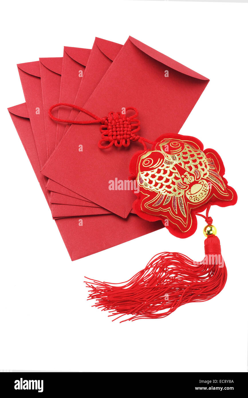 Chinese New Year Red Packets and Auspicious Fish Ornament Stock Photo