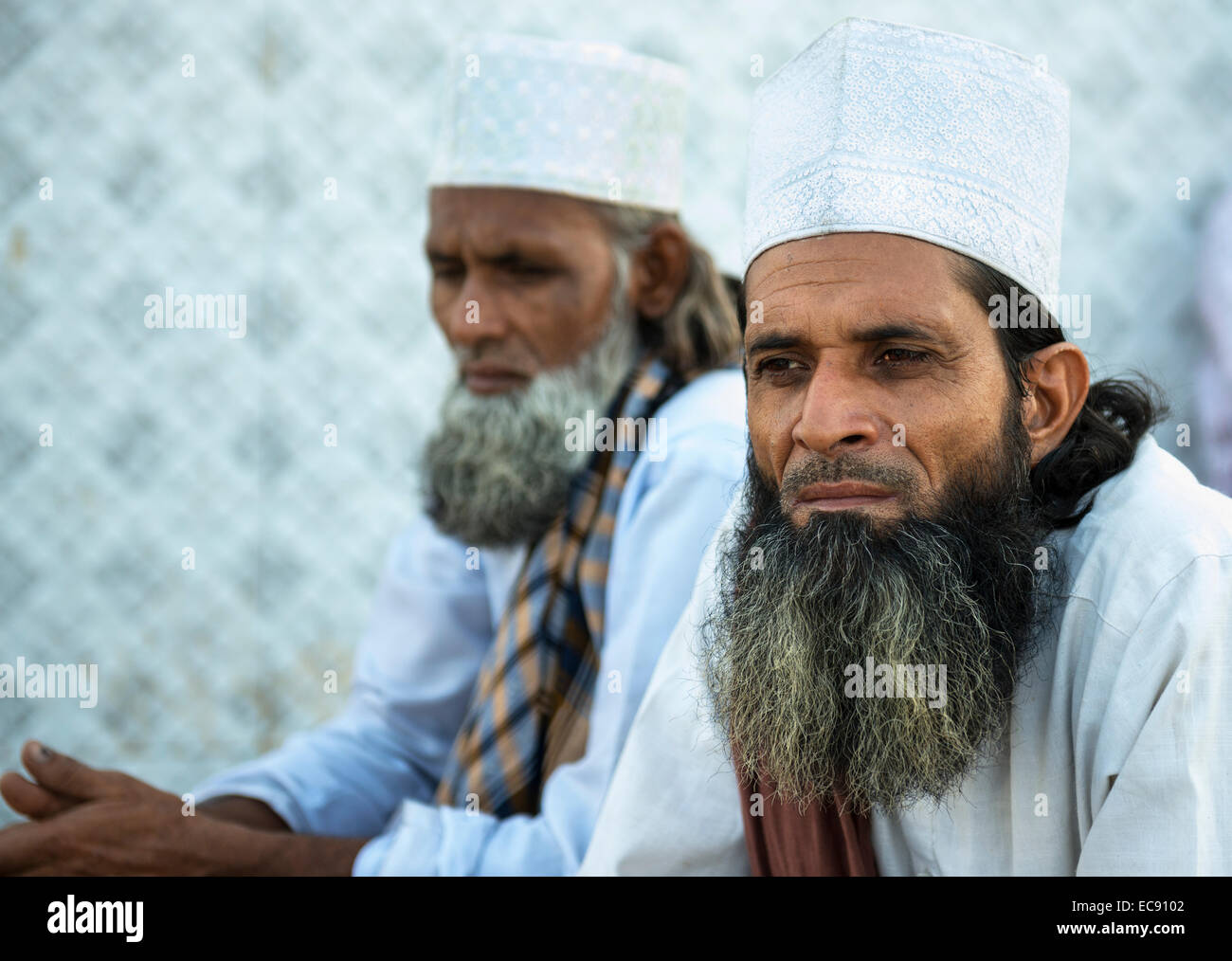 Indian Muslim men wearing a traditional hat Stock Photo - Alamy