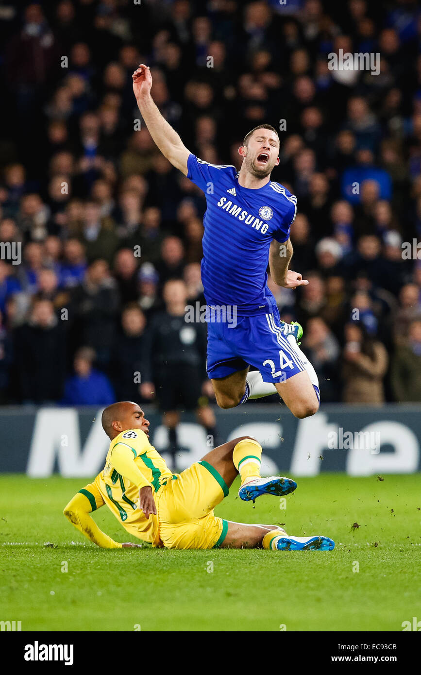 London, UK. 10th Dec, 2014. Joao Mario (Sporting), Gary Cahill (Chelsea) Football/Soccer : Gary Cahill of Chelsea and Joao Mario of Sporting battle for the ball during the UEFA Champions League Group Stage match between Chelsea and Sporting Clube de Portugal at Stamford Bridge in London, England . Credit:  AFLO/Alamy Live News Stock Photo