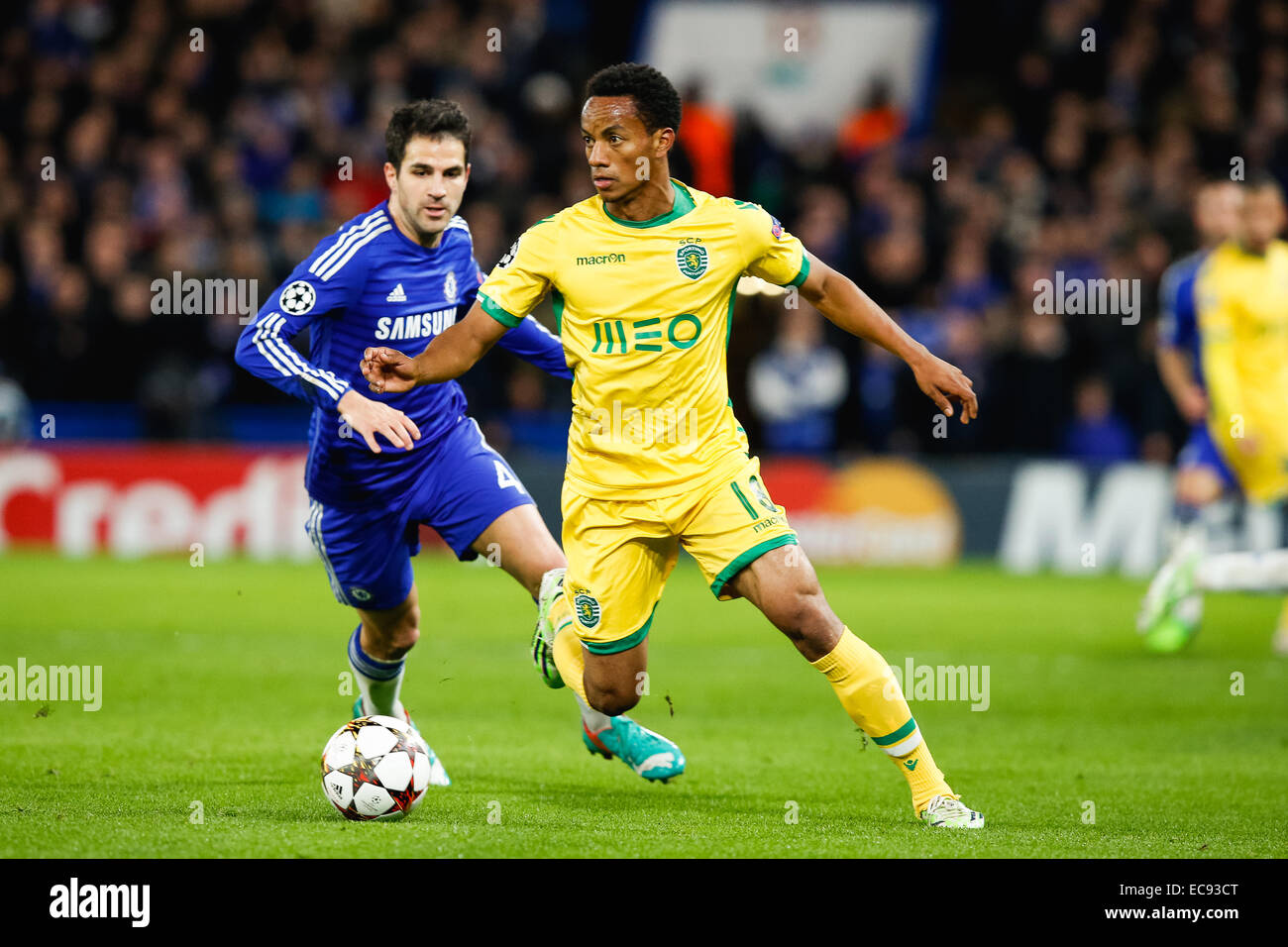 London, UK. 10th Dec, 2014. Andre Carrillo (Sporting), Cesc Fabregas (Chelsea) Football/Soccer : Andre Carrillo of Sporting and Cesc Fabregas of Chelsea during the UEFA Champions League Group Stage match between Chelsea and Sporting Clube de Portugal at Stamford Bridge in London, England . Credit:  AFLO/Alamy Live News Stock Photo