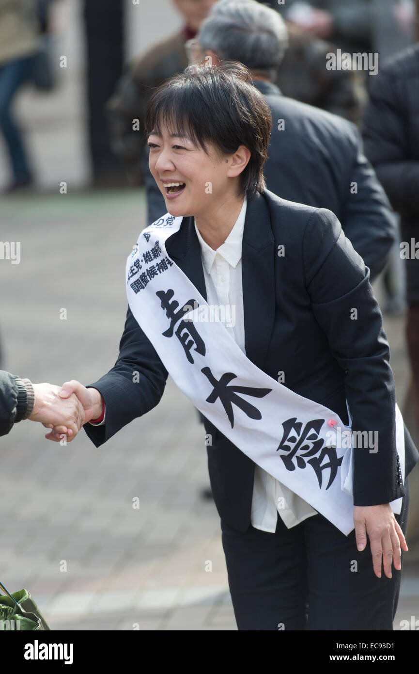 Tokyo, Japan. 10th Dec, 2014. Ai Aoki, a candidate of the People's Life Party, shakes hands with voters during a campaign for the December 14 lower house election in Tokyo on December 10, 2014. © AFLO/Alamy Live News Stock Photo