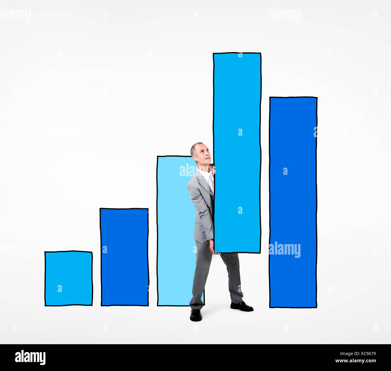 Businessman Working on a Bar Graph Stock Photo