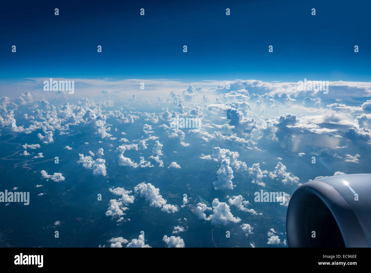plane flying america usa airport aerial view window clouds high altitude 30 000 ft Stock Photo