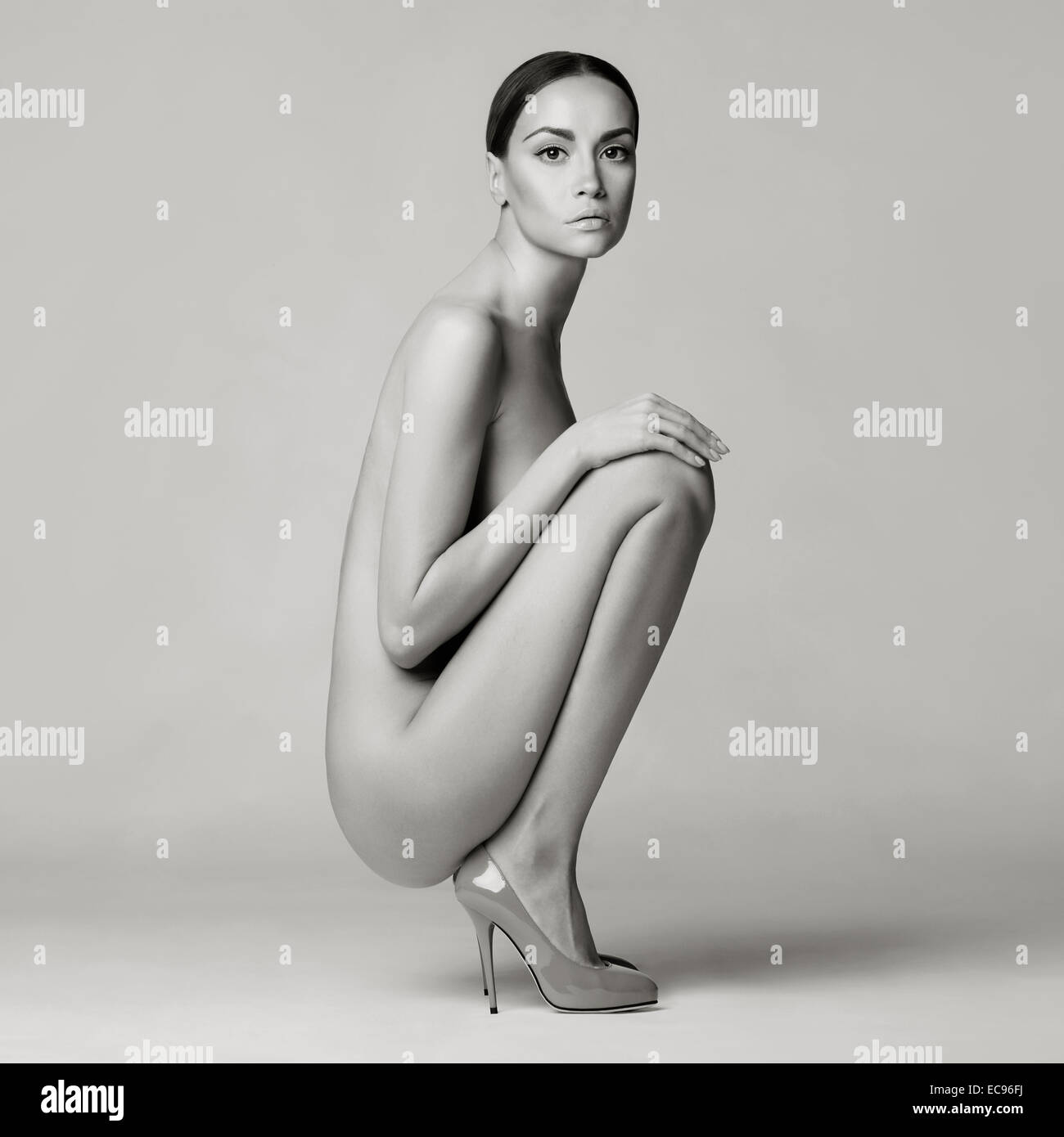 Beautiful Nude Lady With Perfect Body Sits In Red Shoes Conceptual Fashion Art Photo Beautiful Nude Lady With Perfect Body Sits In Red Shoes Conceptual Fashion Art Photo