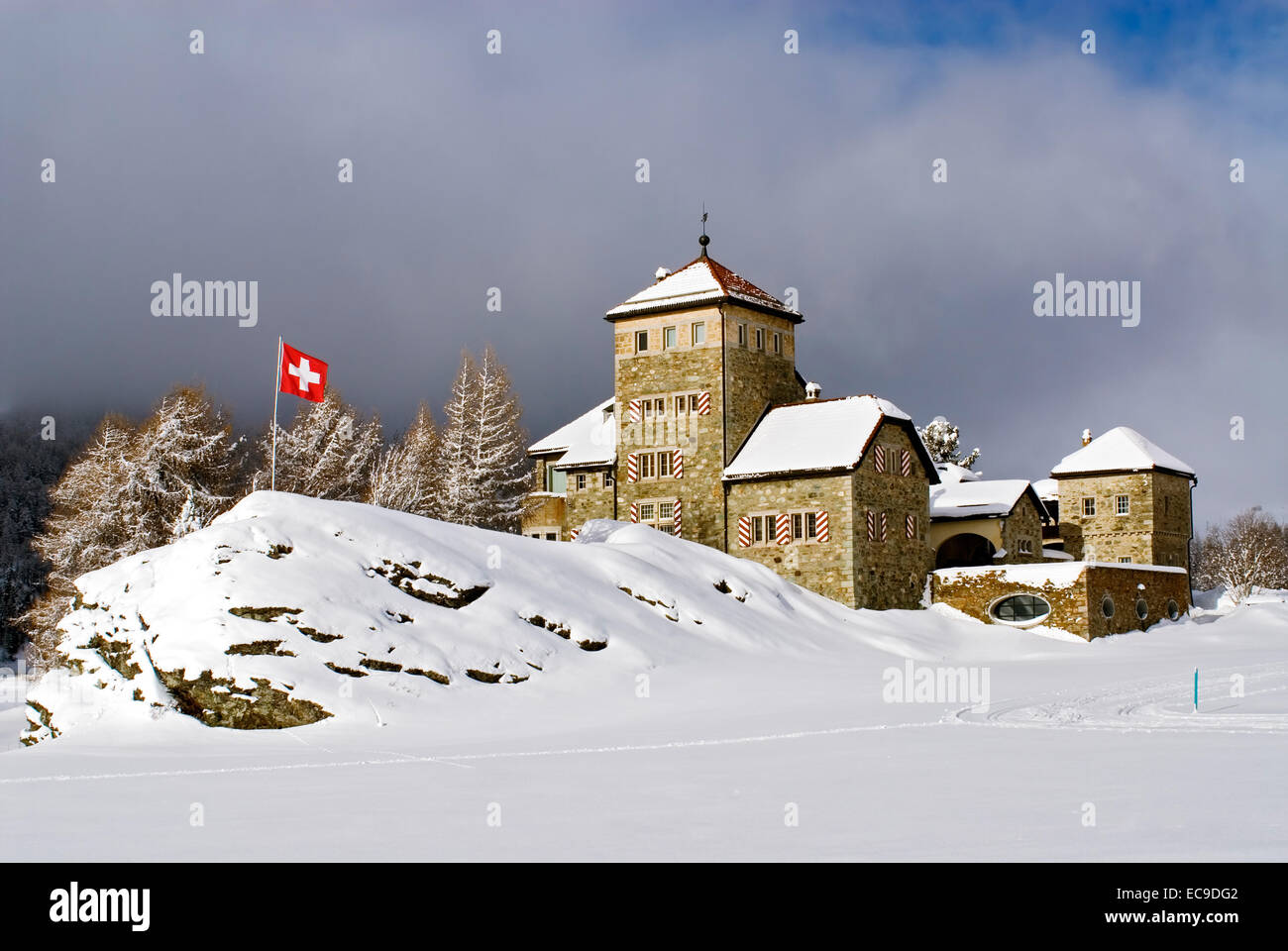 Crap da Sass castle in a winter landscape, village Surlej, Lake Silvaplana, Switzerland Stock Photo
