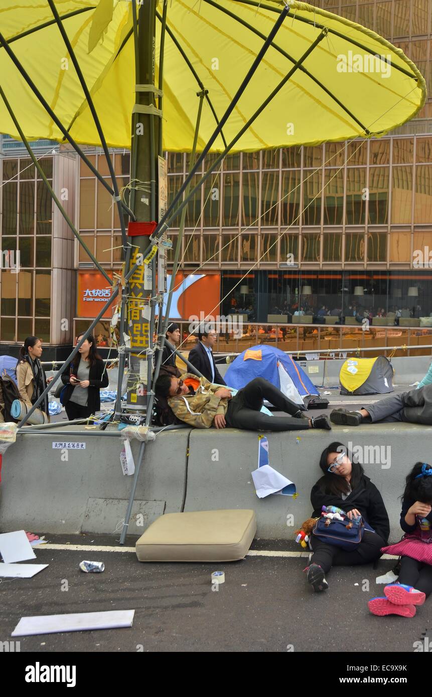 Hong Kong, China. 11th December, 2014. After 74 days of the Occupy Hong Kong protest, protesters sleep at the Admiralty site before police enacted a court injunction to remove protesters and their encampment from Connaught Road Central. The authorities had warned protesters to leave in advance of the clearance, but a few pro-democracy demonstrators remained, leading to a handful of arrests. Credit:  Stefan Irvine/Alamy Live News Stock Photo