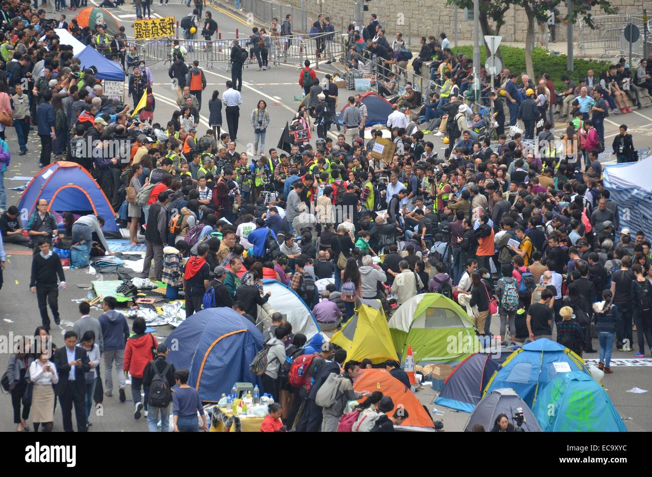 Hong Kong, China. 11th December, 2014. After 74 days of the Occupy Hong Kong protest, a few dozen protesters continue their sit-in at the Admiralty site before police enacted a court injunction to remove protesters and their encampment from Connaught Road Central. The authorities had warned protesters to leave in advance of the clearance, but a few pro-democracy demonstrators remained, leading to a handful of arrests. Credit:  Stefan Irvine/Alamy Live News Stock Photo