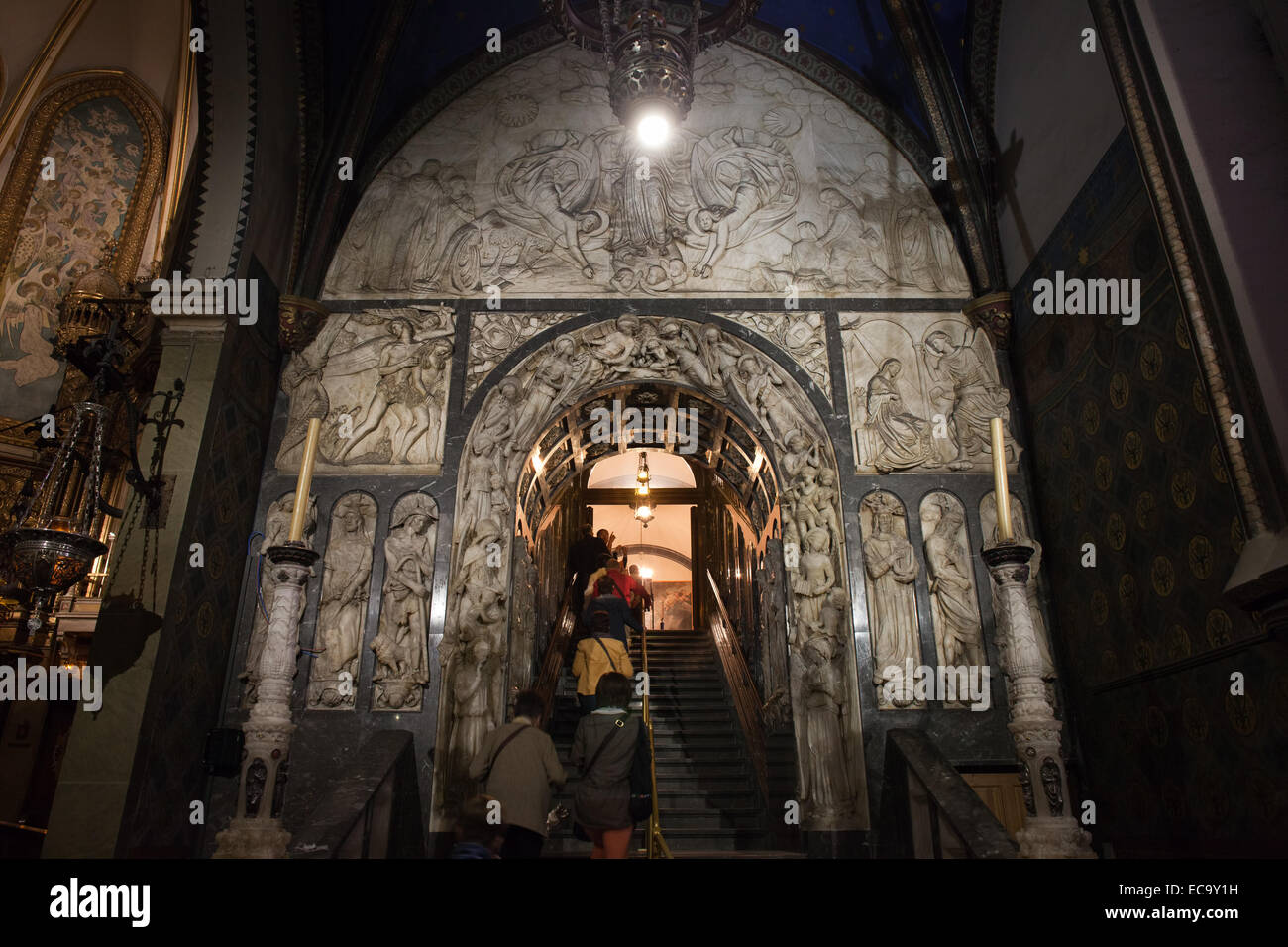 Basilica interior of the Montserrat Monastery in Catalonia, Spain. Pilgrims and tourists queueing up to the Black Madonna statue Stock Photo