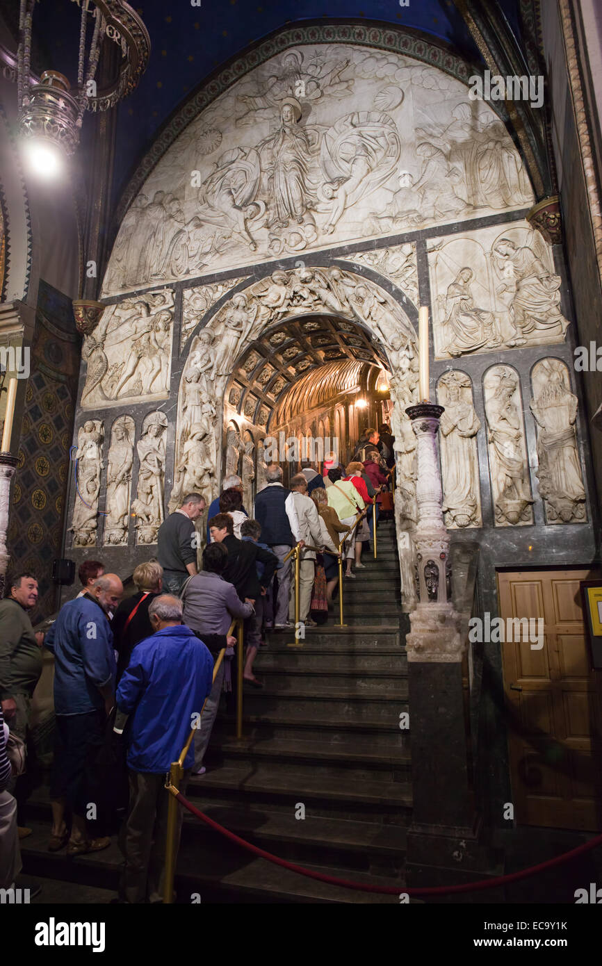 Basilica interior of the Montserrat Monastery in Catalonia, Spain. Pilgrims and tourists queueing up to the Black Madonna statue Stock Photo